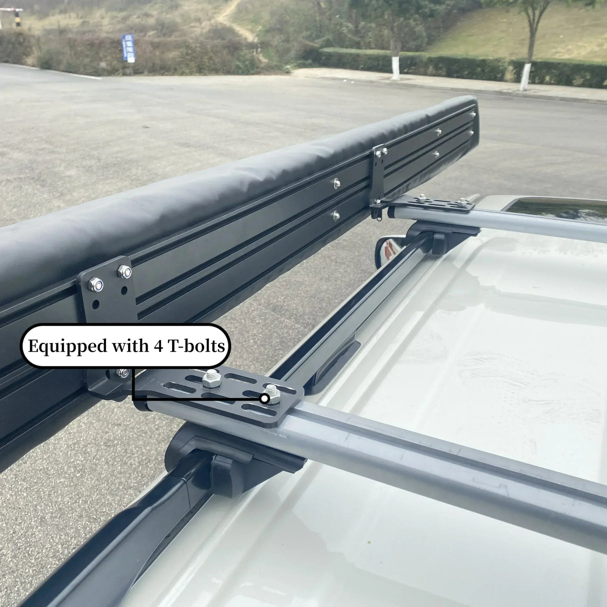 Close-up of the mounting bracket on roof rails, panel stating four T-bolts