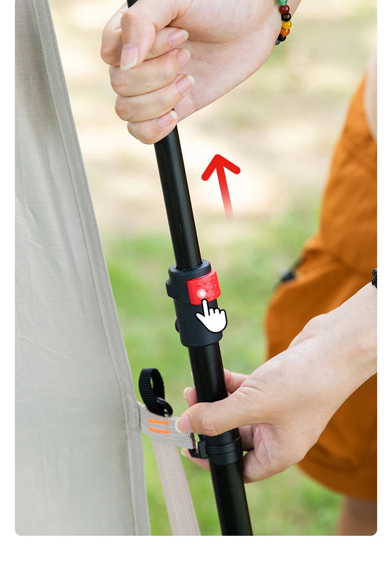 Close-up of a hand extending the tent's telescopic pole, with the red release button marked.