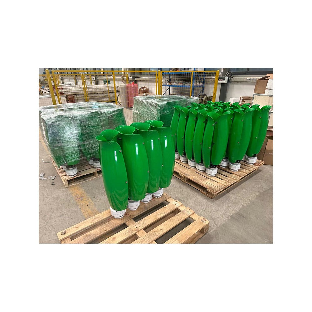 Green T-500W tulip turbines palletised for shipping on the factory floor
