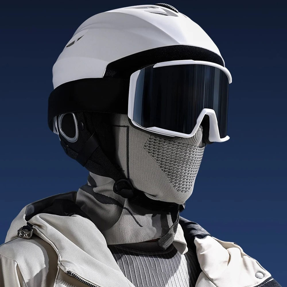 Grey balaclava worn under a white ski helmet and goggles