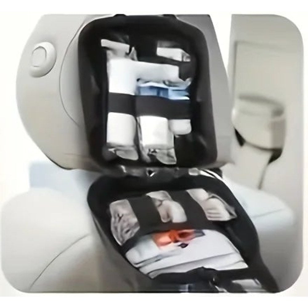 Dark first aid bag strapped to the back of a car seat headrest and opened flat, with bandages held in elastic loops