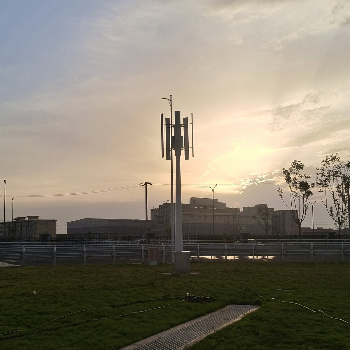 H1000 vertical wind turbine on its mast at sunset