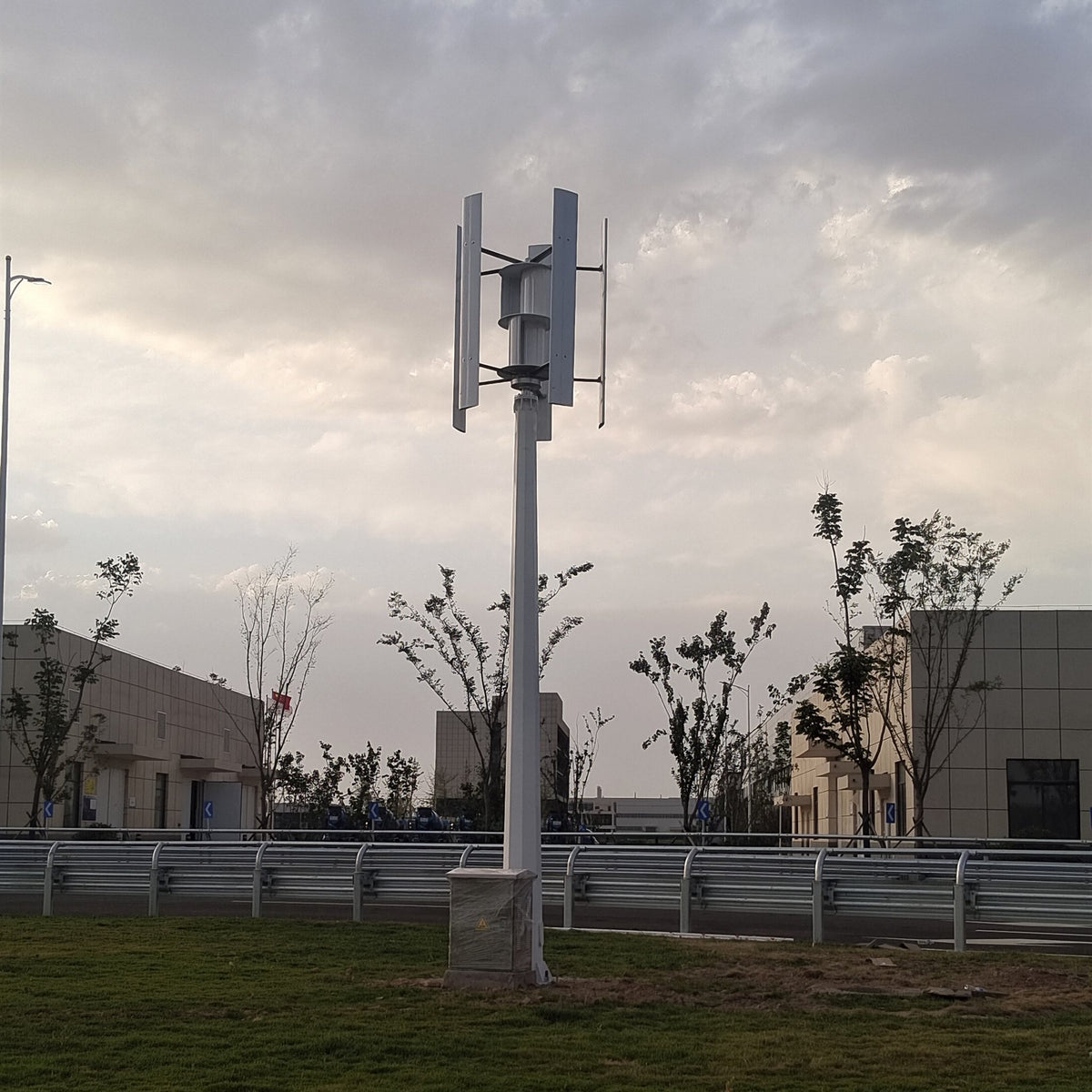 H1000 vertical wind turbine on a mast over open grassland