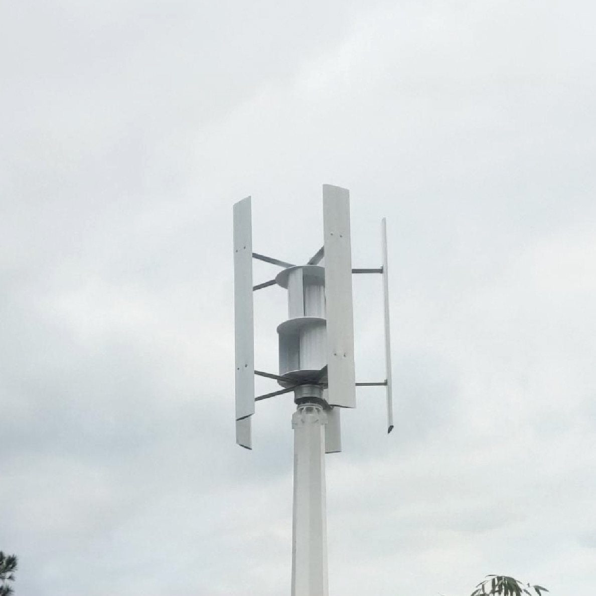 H1000 installed on its mast with the crane truck that lifted it parked below