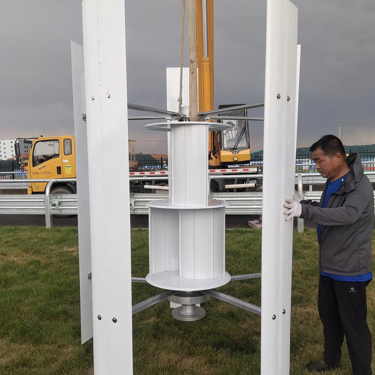 Installer standing beside the assembled H1000 rotor, showing its size before it goes up the mast