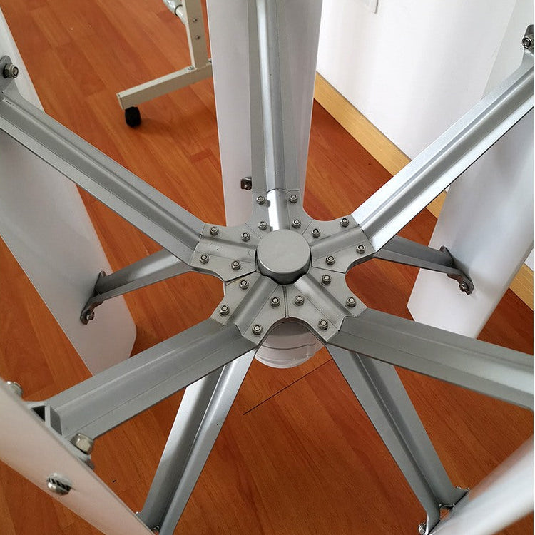 Looking down at the H12 rotor hub: five bolted aluminium struts radiating from the centre shaft to the vertical blades - representative family photo