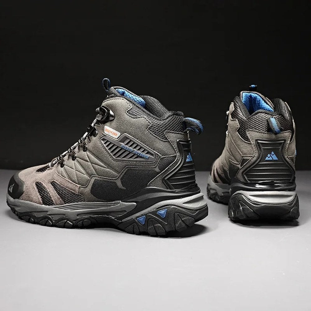 Pair of grey HIKEUP boots from the side and back, showing the moulded heel piece and tongue pull loop