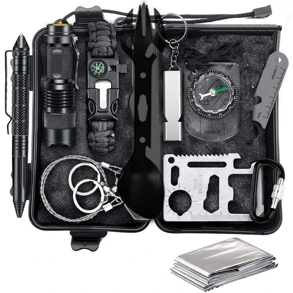 11-tool survival kit in an open black hard case with pen, torch, paracord bracelet, spork, whistle, baseplate compass, ruler plate, card tool, carabiner, wire saw and foil blanket