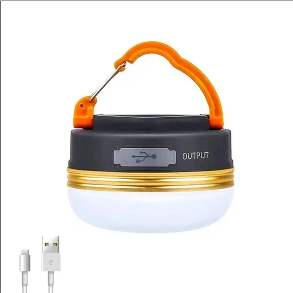 Small round camp lamp with an orange carabiner handle, a USB output port and its charging cable