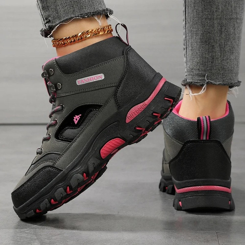 Grey hiking boot from the side and back, showing the above-the-ankle collar and the heel of the lug sole