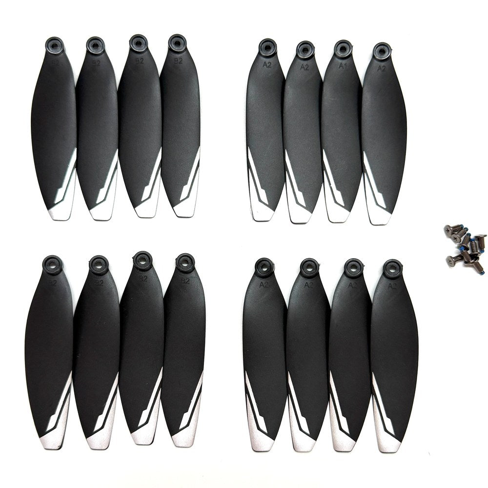 Sixteen black XT606 drone propellers with white tips and their mounting screws