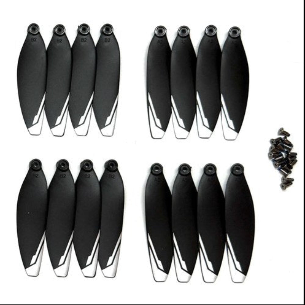 Thirty-two black XT606 drone propellers with white tips and their mounting screws