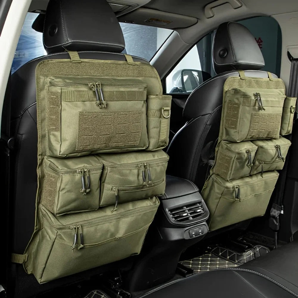 Two army green zipped seat back organisers on the front seats of a car