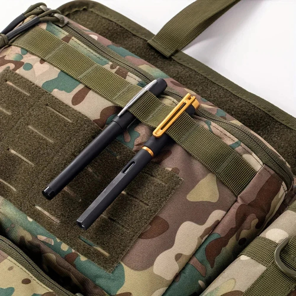 Two pens held under the webbing on the laser-cut panel of the top pouch