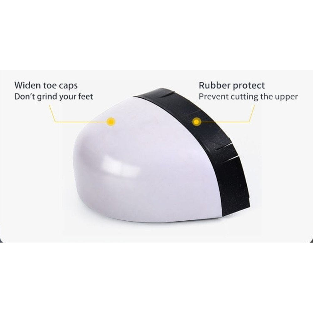 White plastic toe cap with a black rubber edge, the cap fitted inside the boot