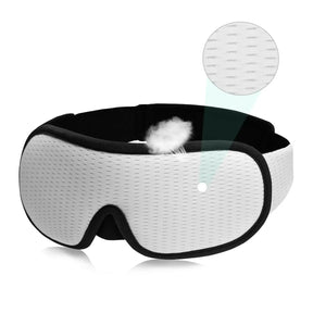 White contoured sleep mask with black trim and a close-up of the outer fabric weave