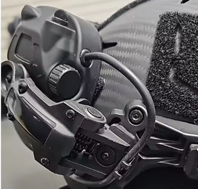 Close-up of a tactical device with a focus on its components.