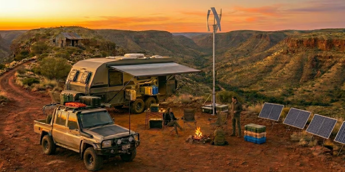 Off-road vehicle with camper and solar panels in a desert landscape at sunset