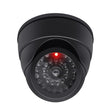 Black dummy dome camera close up, imitation infrared beads circling a non-working lens