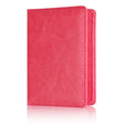 Rose red passport cover standing upright, embossed lettering just visible on the front