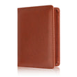 Tan brown passport cover standing upright, showing the grain finish and edge stitching
