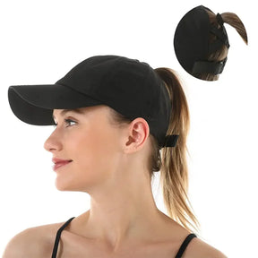 Black cap worn in profile, inset close-up of the rear strap and ponytail opening