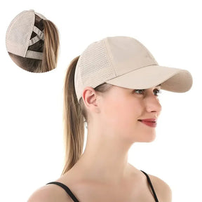 Beige cap worn with a ponytail through the back, inset shows the crossed straps