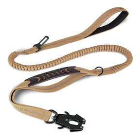 Khaki bungee dog lead laid flat, rubber traffic handle over the elastic section
