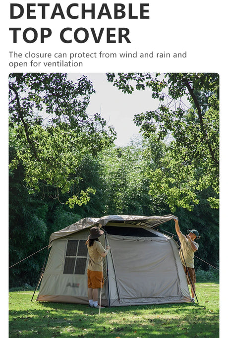 Two campers lifting the detachable top cover clear of the pitched tent on a grassy site.