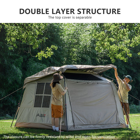 Two campers lifting the separate top cover onto the pitched cabin tent, showing how it detaches.