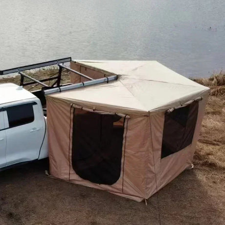 Khaki awning with zip-on wall panels and mesh windows set up lakeside