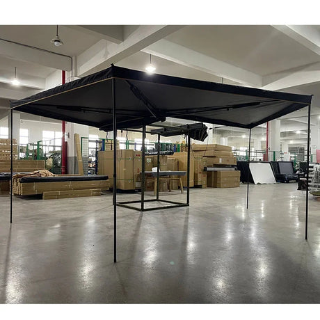 Free-standing pole model opened indoors, canopy held up by adjustable legs