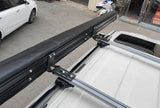 Close-up of the stowed awning bag bolted to a vehicle's roof rails