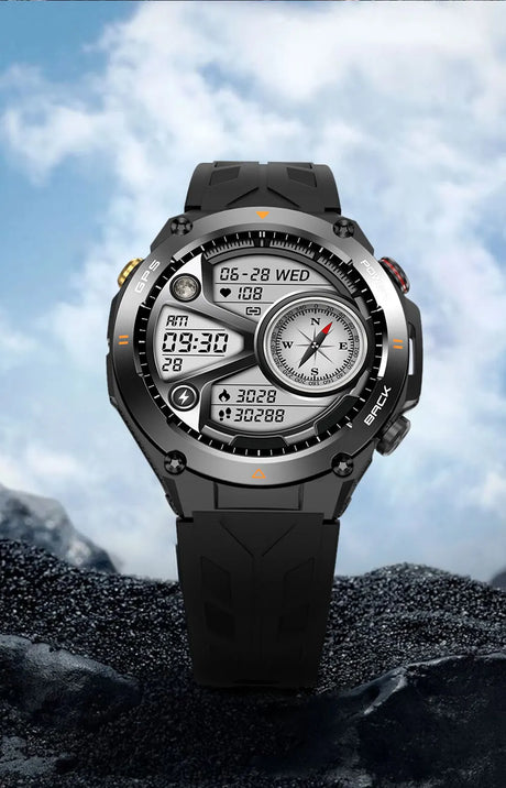 Black digital watch with compass and timer on a rocky surface with blue sky