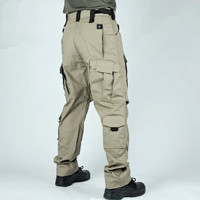 Khaki cargo trousers worn from behind, showing rear pocket flap and lower-leg cargo pocket