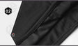 Close-up two: overlocked seam stitching running along a folded edge of the fabric.