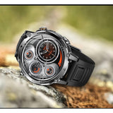 AK106 1400 mAh GPS smartwatch, steel case and black silicone strap, resting on a rock