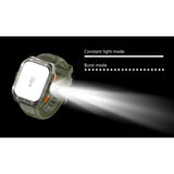 Green W80 Pro with its torch beam on, beside the constant light and burst torch modes