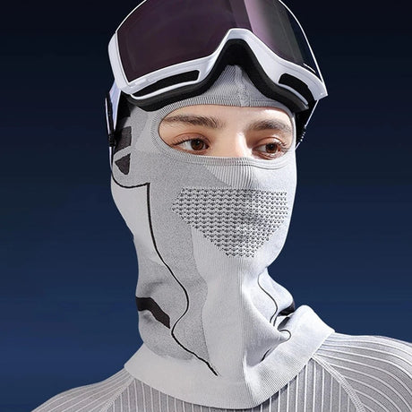 Grey balaclava worn under ski goggles, eye opening above a mesh mouth panel