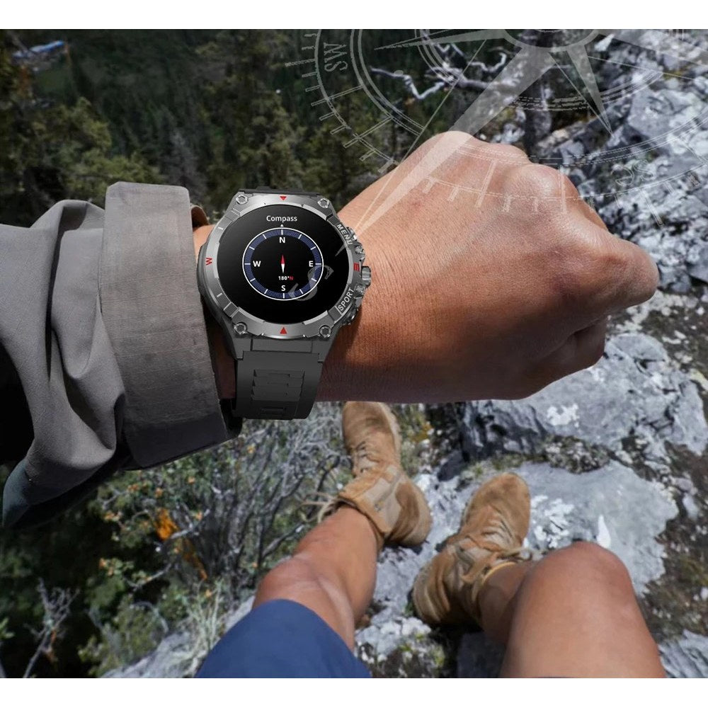 COLMI V76 on a wrist showing the compass screen, sitting above a mountain valley