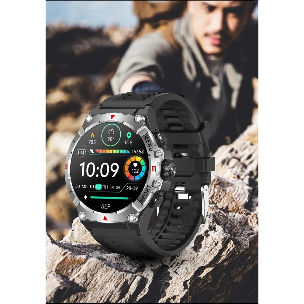 Silver-bezel COLMI V76 watch on a rock with a walker climbing behind