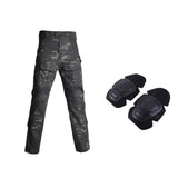 Black camouflage combat-cut trousers beside two black knee pads