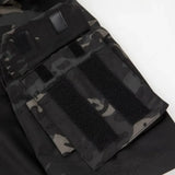Close-up of the upper-arm pocket with hook-and-loop panels, black camo sleeve