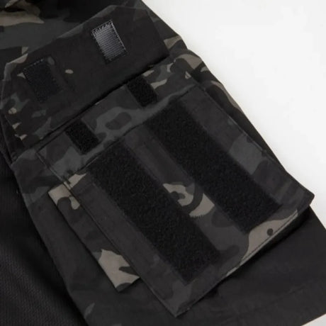 Close-up of the upper-arm pocket with hook-and-loop panels, black camo sleeve