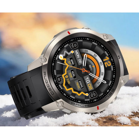 DM59 offline map GPS smartwatch, silver case with a black silicone strap, resting on snow