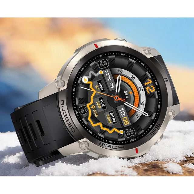 DM59 offline map GPS smartwatch, silver case with a black silicone strap, resting on snow
