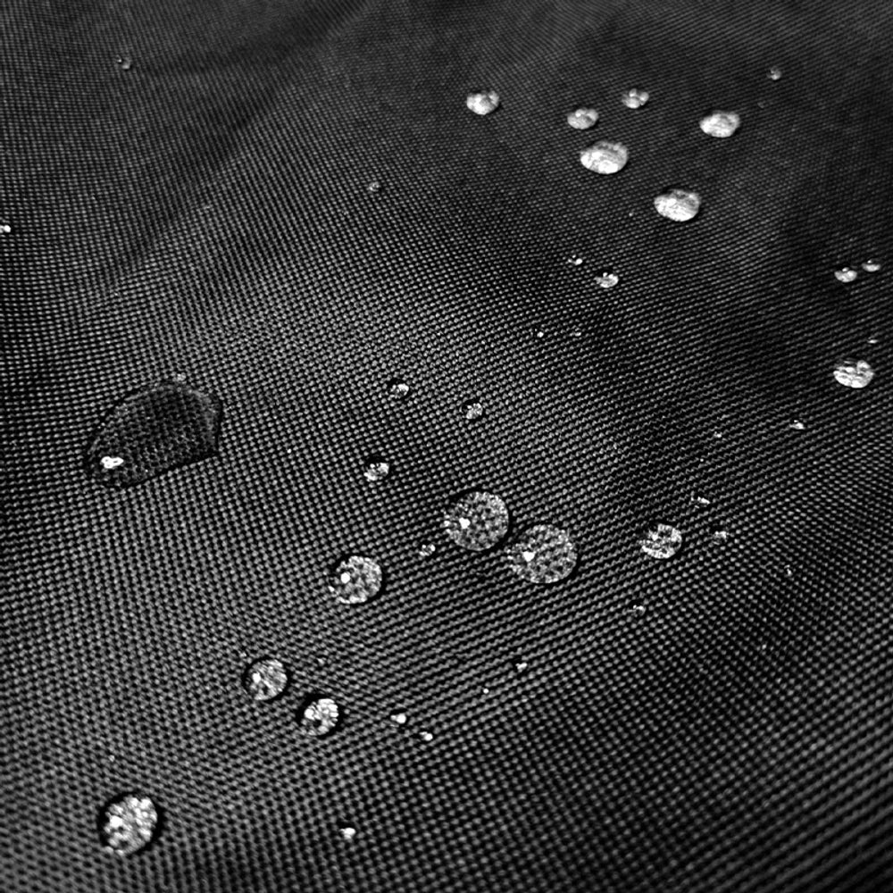 Close-up of the black 600D Oxford fabric with water droplets beading on the surface