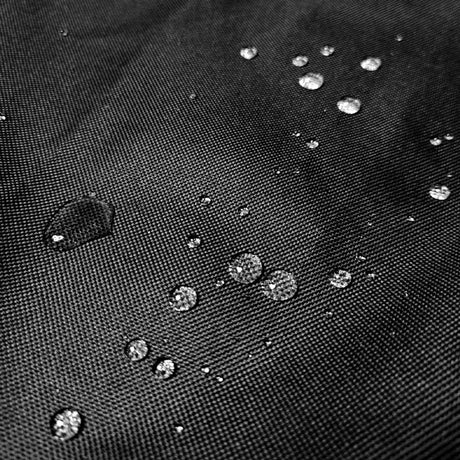 Close-up of the black 600D Oxford fabric with water droplets beading on the surface