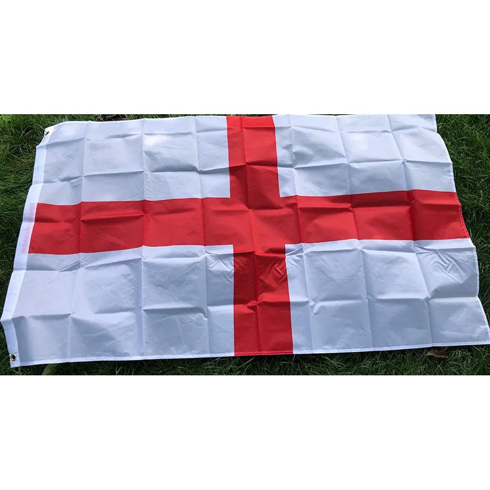 England flag in printed polyester laid flat on grass: red St George's Cross on white, white header strip at left