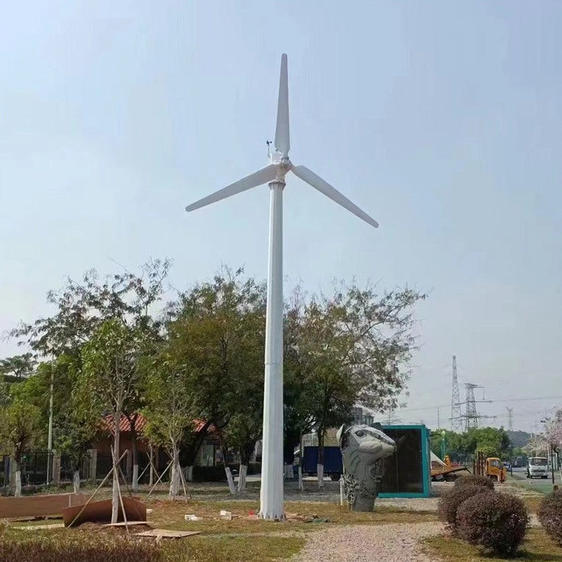 G Type horizontal wind turbine on a tall white ground mast above parkland trees - representative family photo